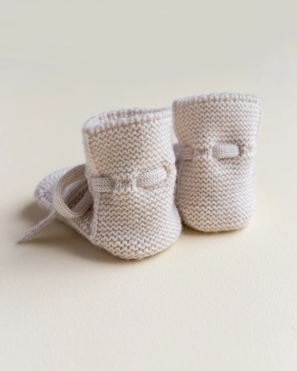 Merinould babyfutter i Cream set bagfra med hælform